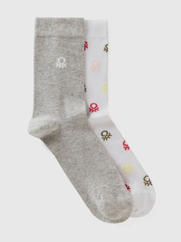 Two pairs of long socks with logos