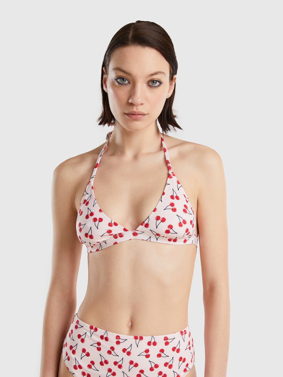 Pink triangle bikini top with cherry pattern