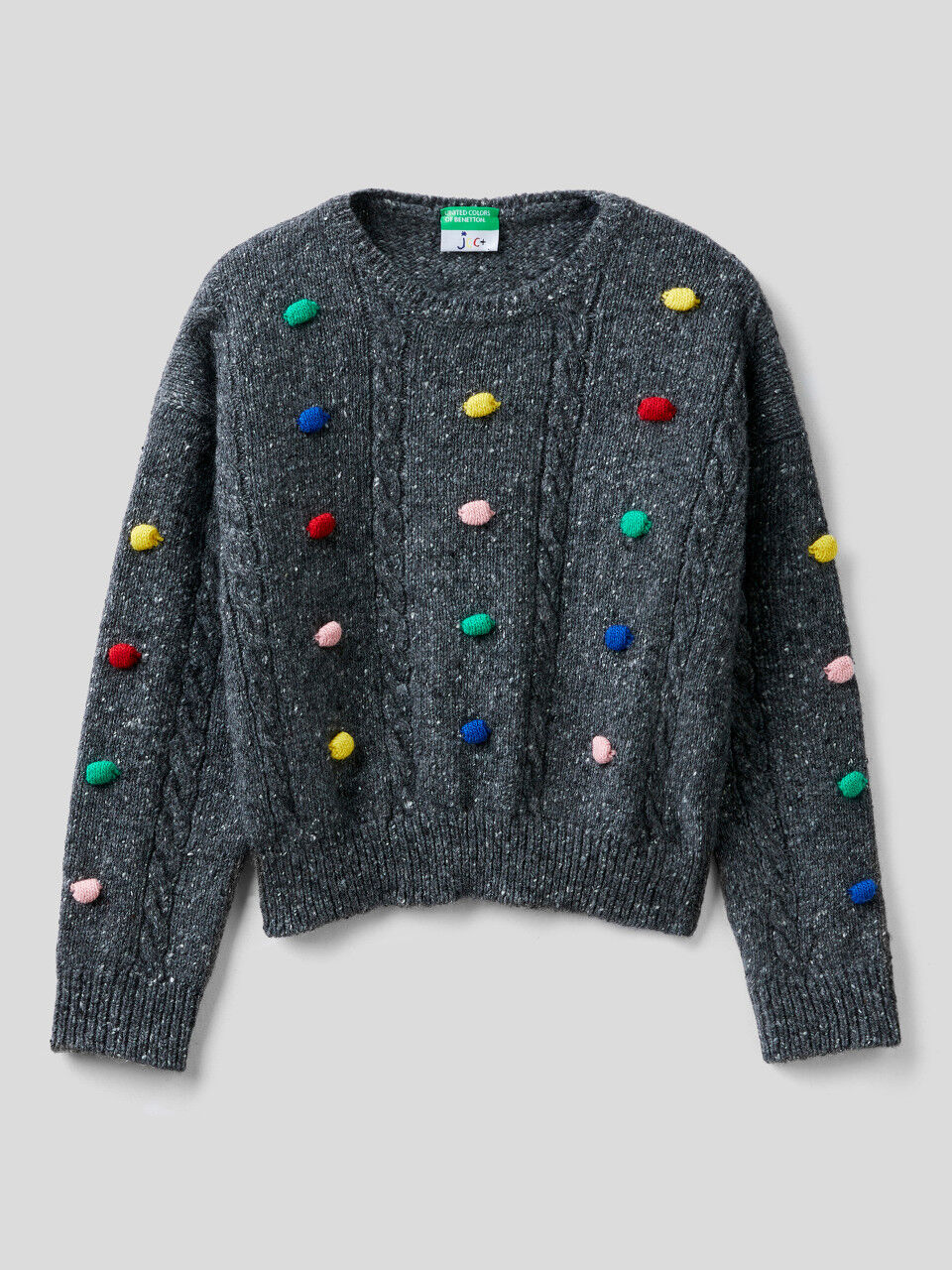 JCCxUCB sweater with pom pom