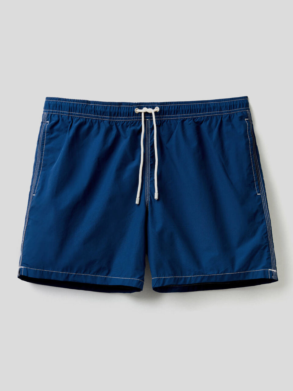 Swim trunks with clashing details image number 1