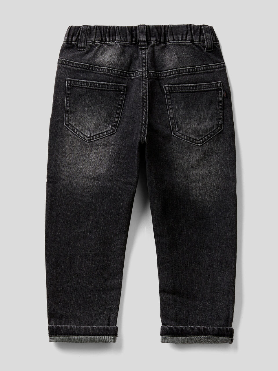 Jeans with tears and print image number 2